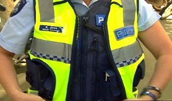 Police in bullet proof vest